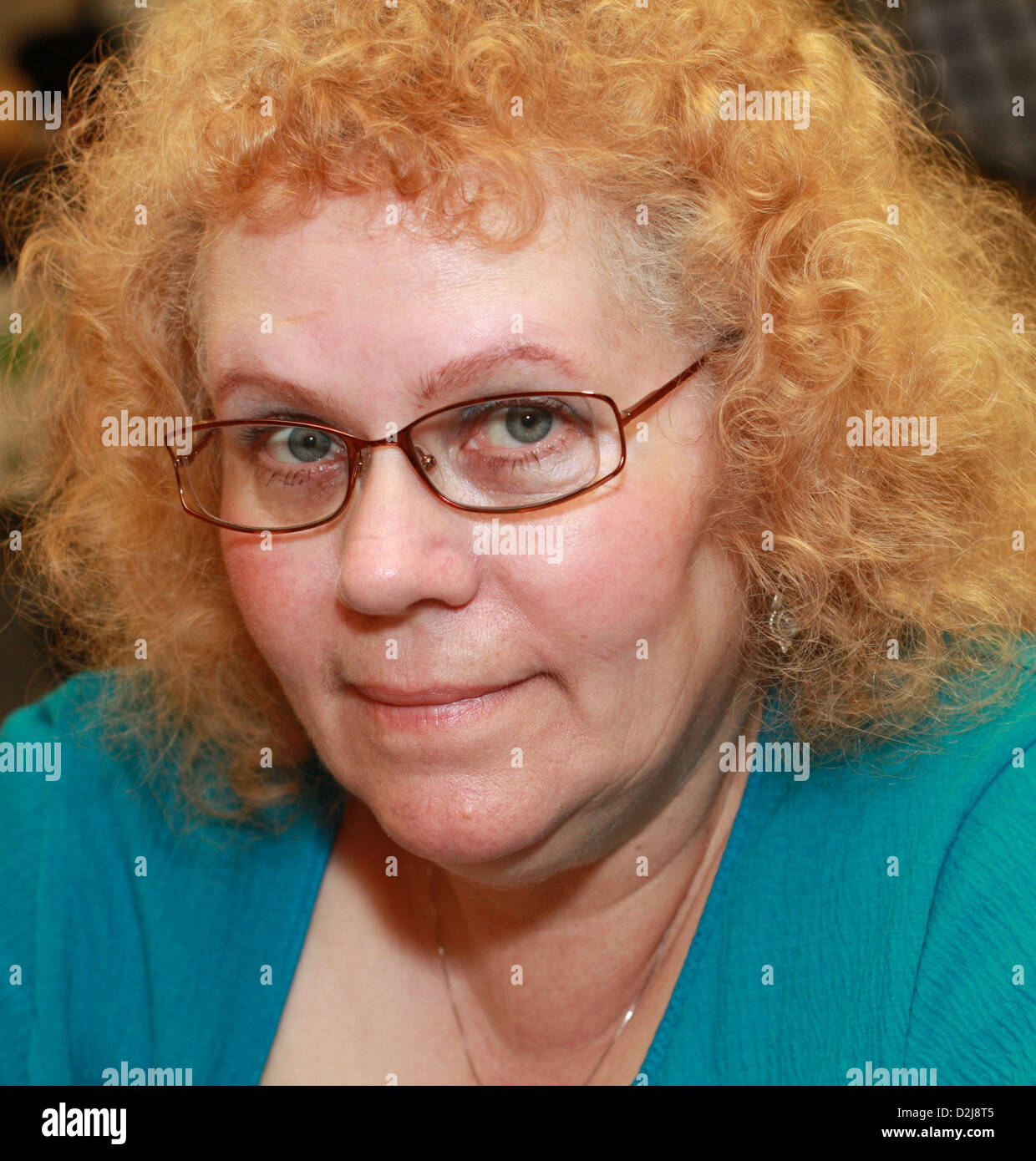 Close up of a heavy set middle aged woman with glasses Stock Photo