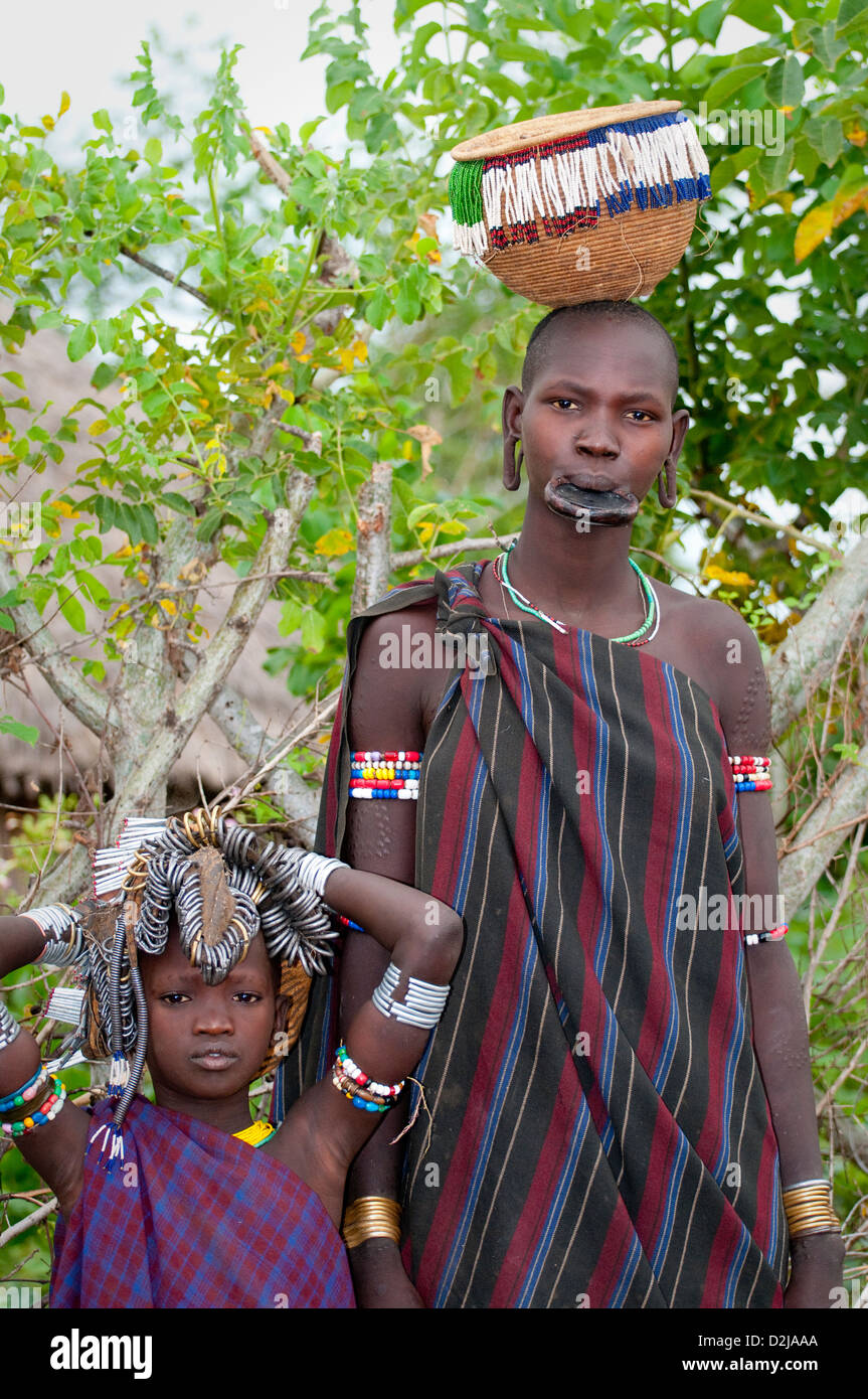 Portrait of Mursi woman with lip plate and child-Omo Valley Stock Photo