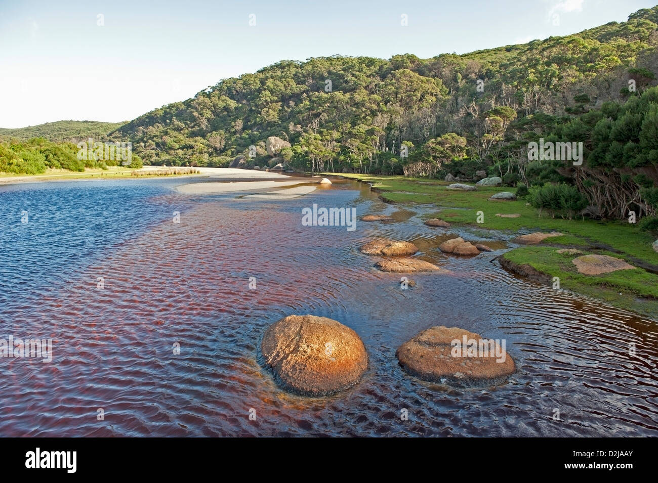 Rocks sticking out blue water hi-res stock photography and images - Alamy