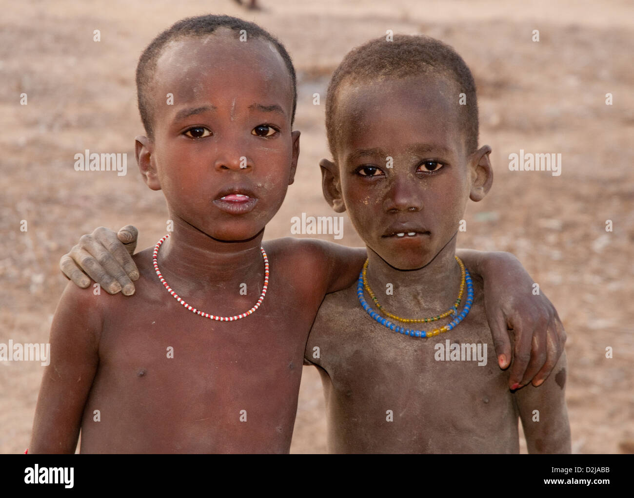 Two Arbore boys with arms around each other Stock Photo - Alamy