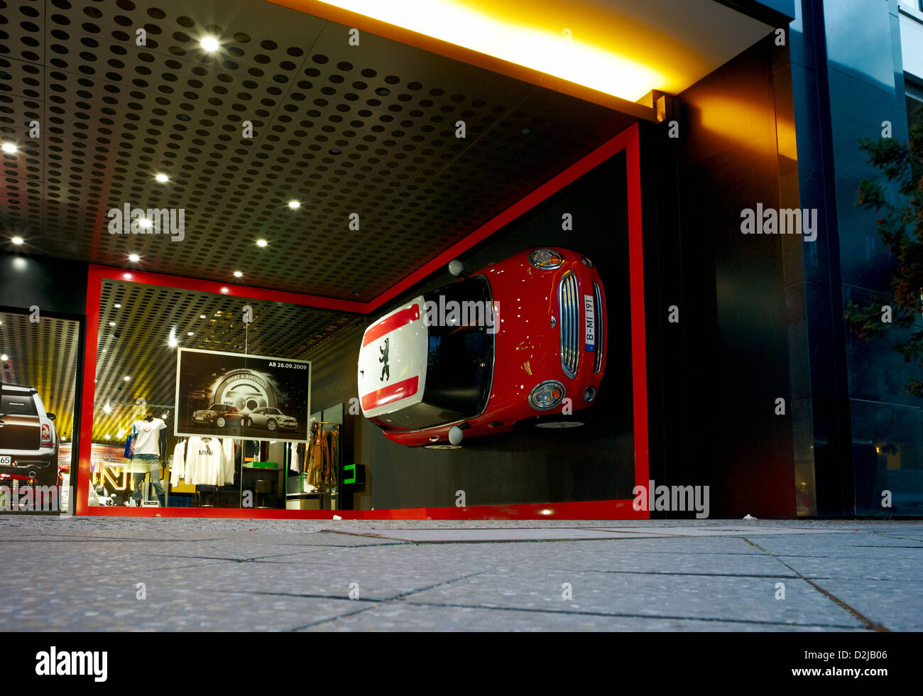 Berlin, Germany, a Mini Cooper hangs on a wall of the mini-stores Stock Photo
