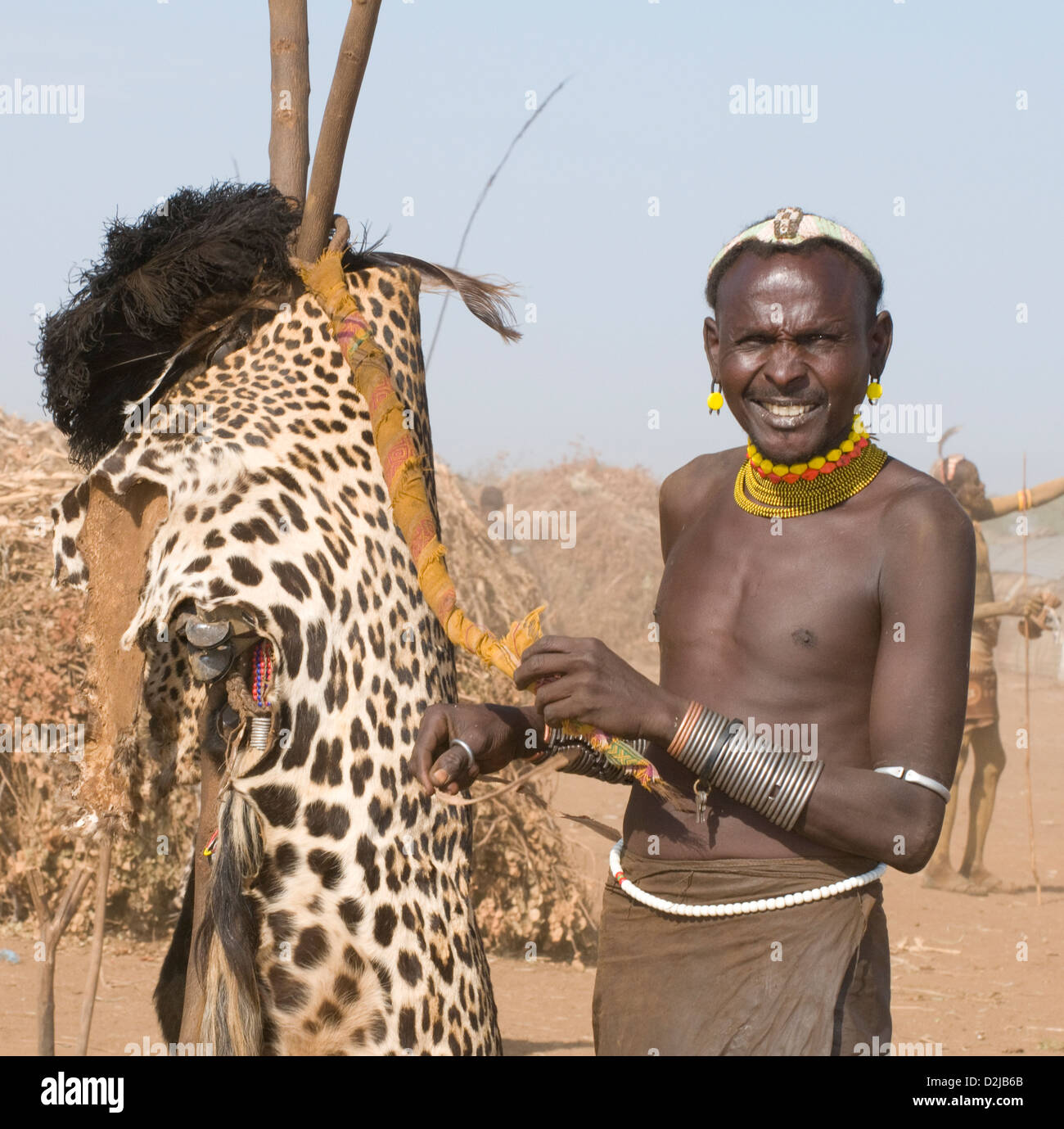 Dassenech Chief By Pole With Leopard Skin Preparing For Dimi Ceremony Stock Photo Alamy [ 1379 x 1300 Pixel ]