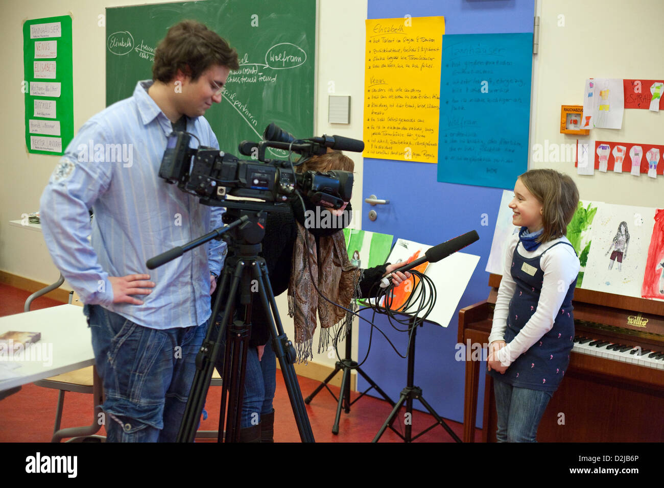 Berlin, Germany, a student gives an interview a TV crew Stock Photo