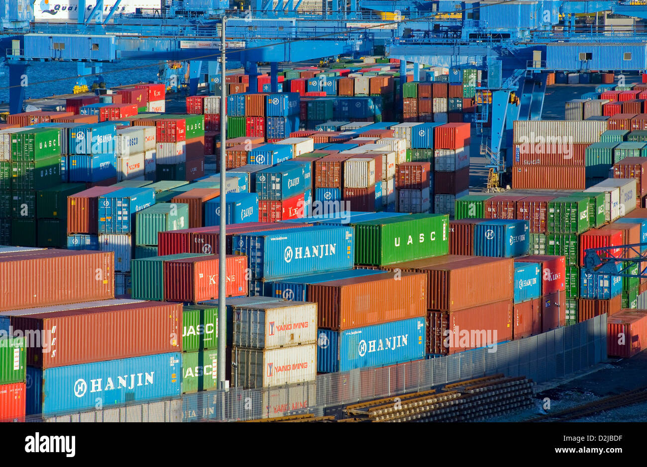 Genoa, Italy, by stacked containers in the container port of Genoa Stock Photo