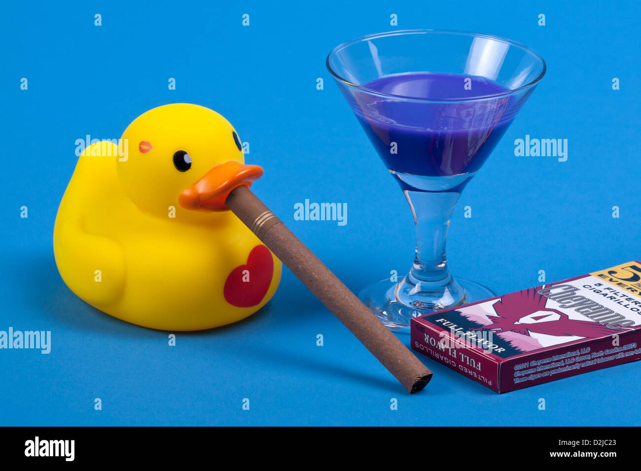 Yellow rubber duck with drink and cigar Stock Photo - Alamy