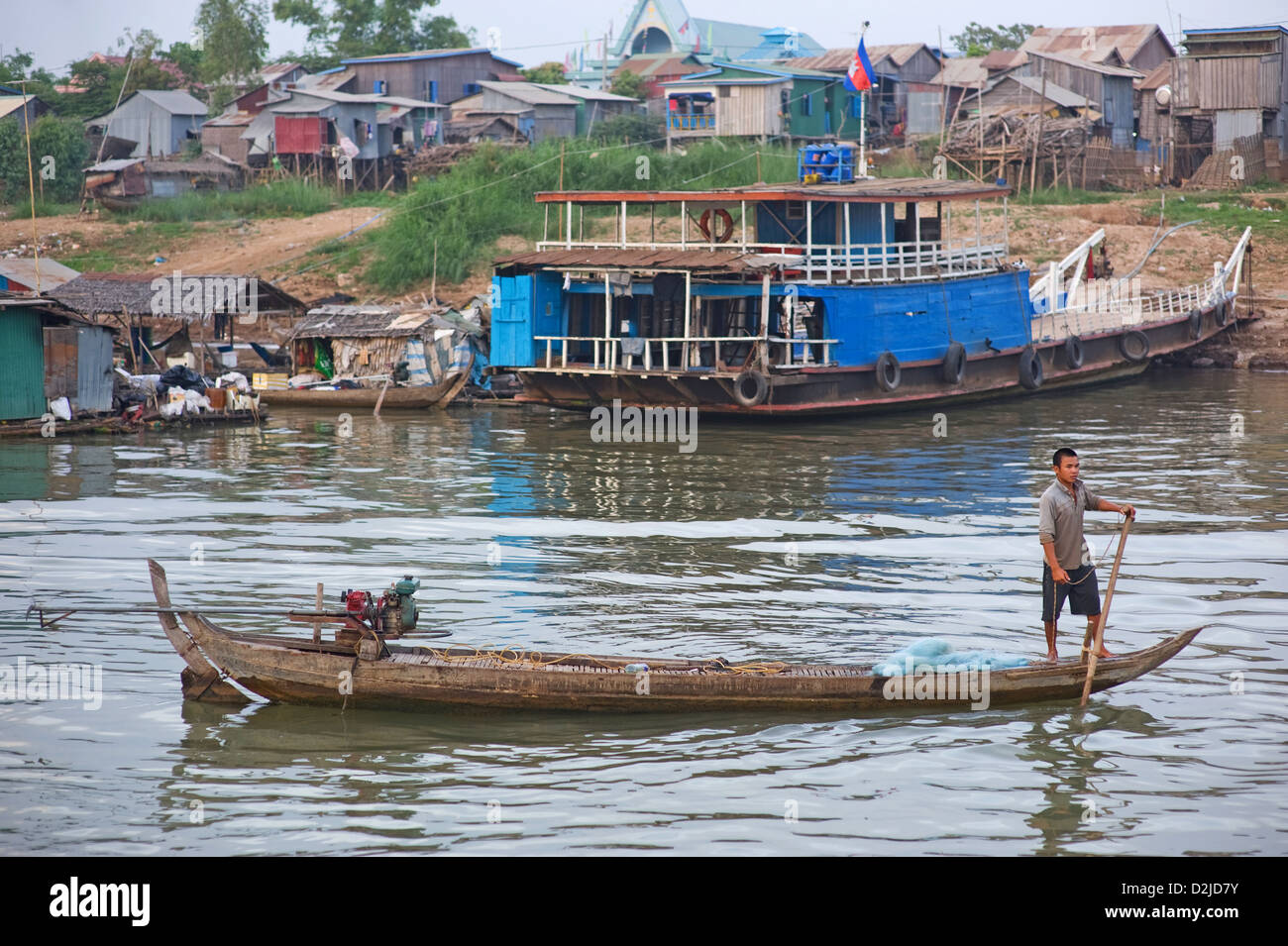 Phnom Penh, Cambodia, a fishing boat in front of a F √ § hre at the banks of the Mekong Stock Photo