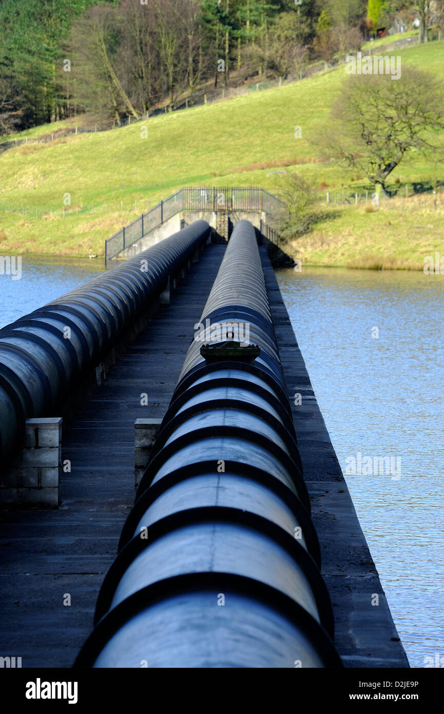 Water supply pipes across ladybower reservoir derwent valley derbyshire england uk Stock Photo