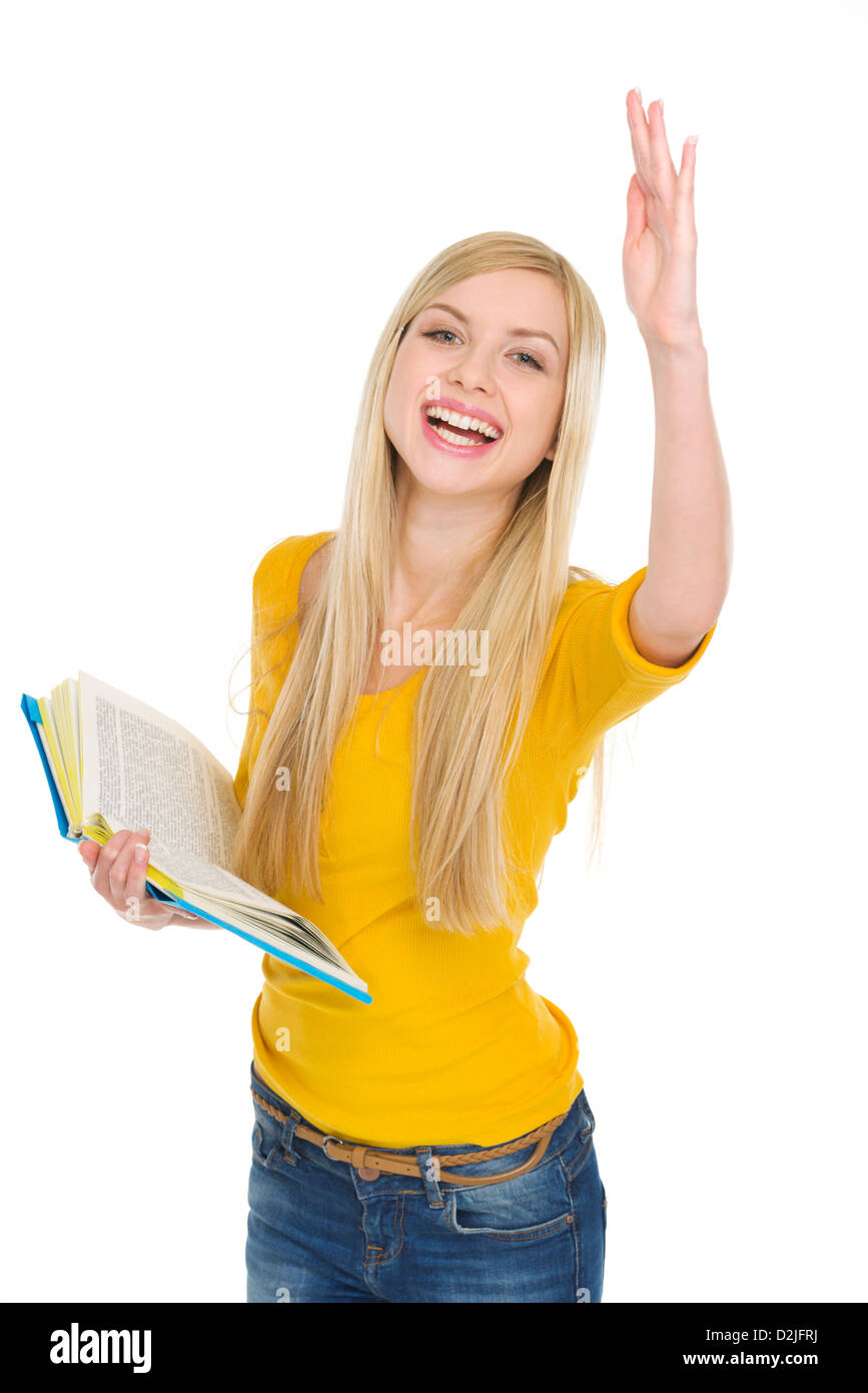 Happy student girl with book rising hand to answer Stock Photo - Alamy