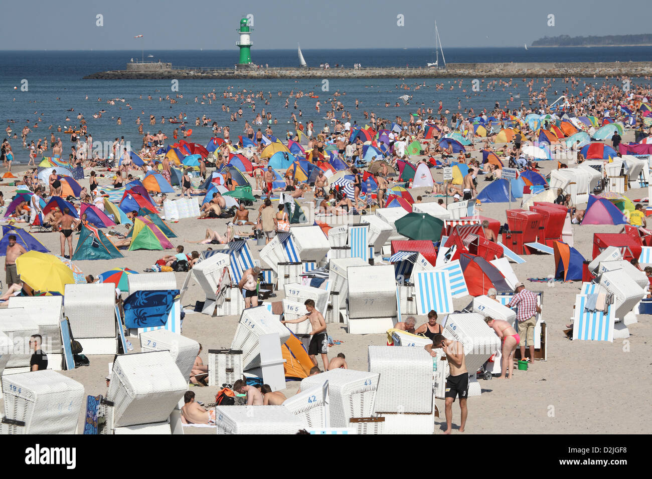 Rostock-Warnemuende, Germany, many tourists on the beach Stock Photo