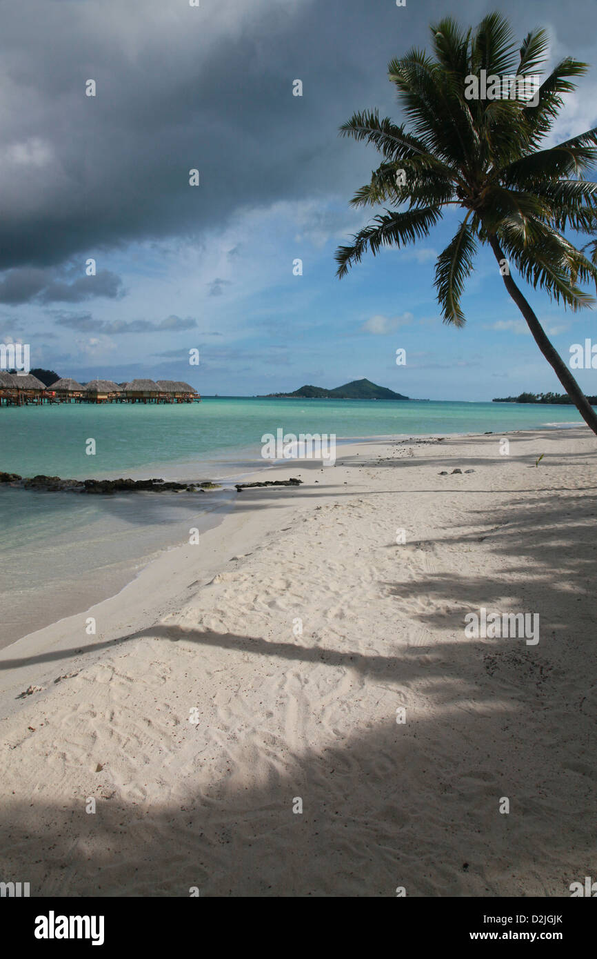 Over-water bungalows on the lagoon at Bora Bora Stock Photo