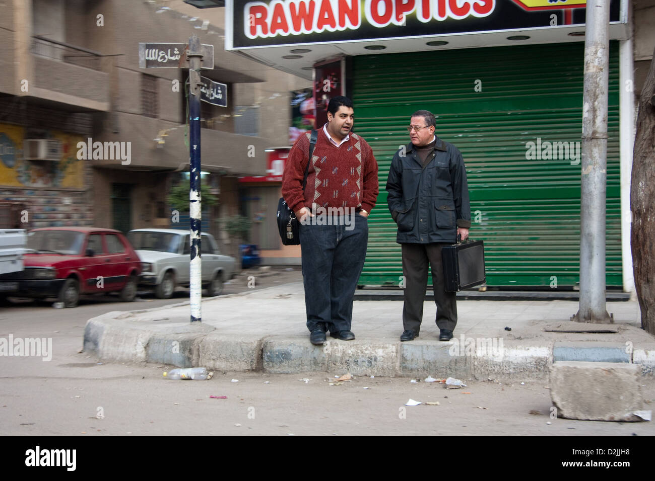 Cairo, Egypt, men on a street corner on the way to work Stock Photo