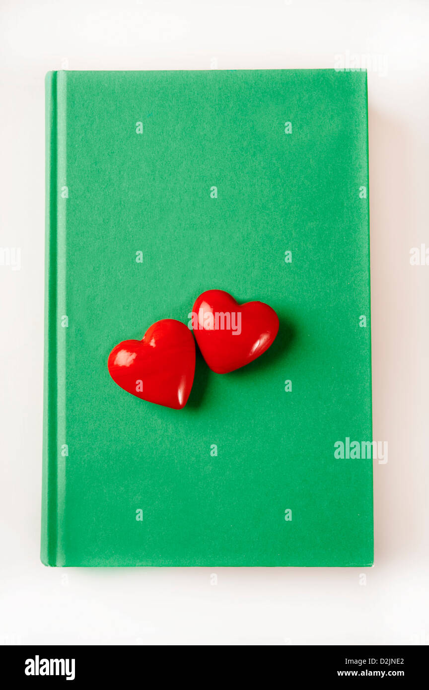valentine hearts on a book, love for books and world book day concept Stock Photo
