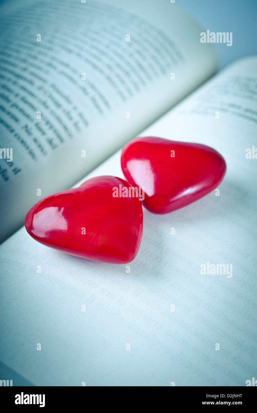 open book and two valentine hearts Stock Photo