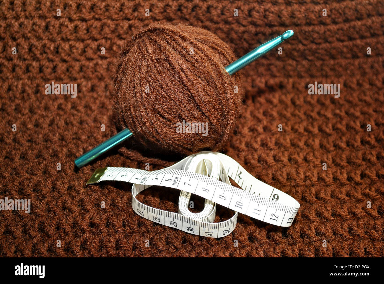 Tape Measure on Brown Crochet Stock Photo