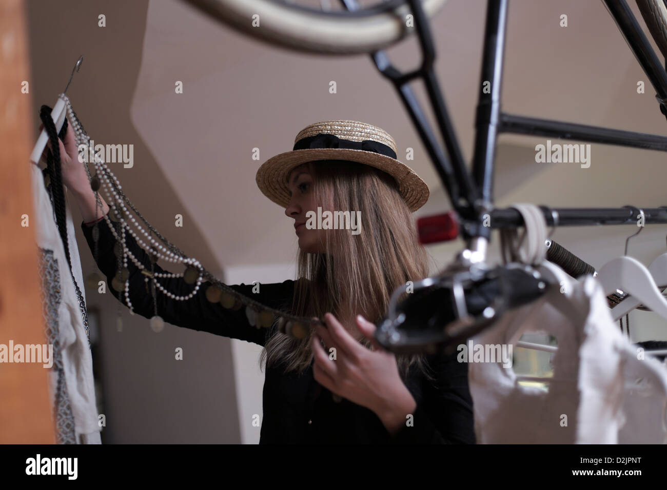Girl checking clothes Stock Photo - Alamy