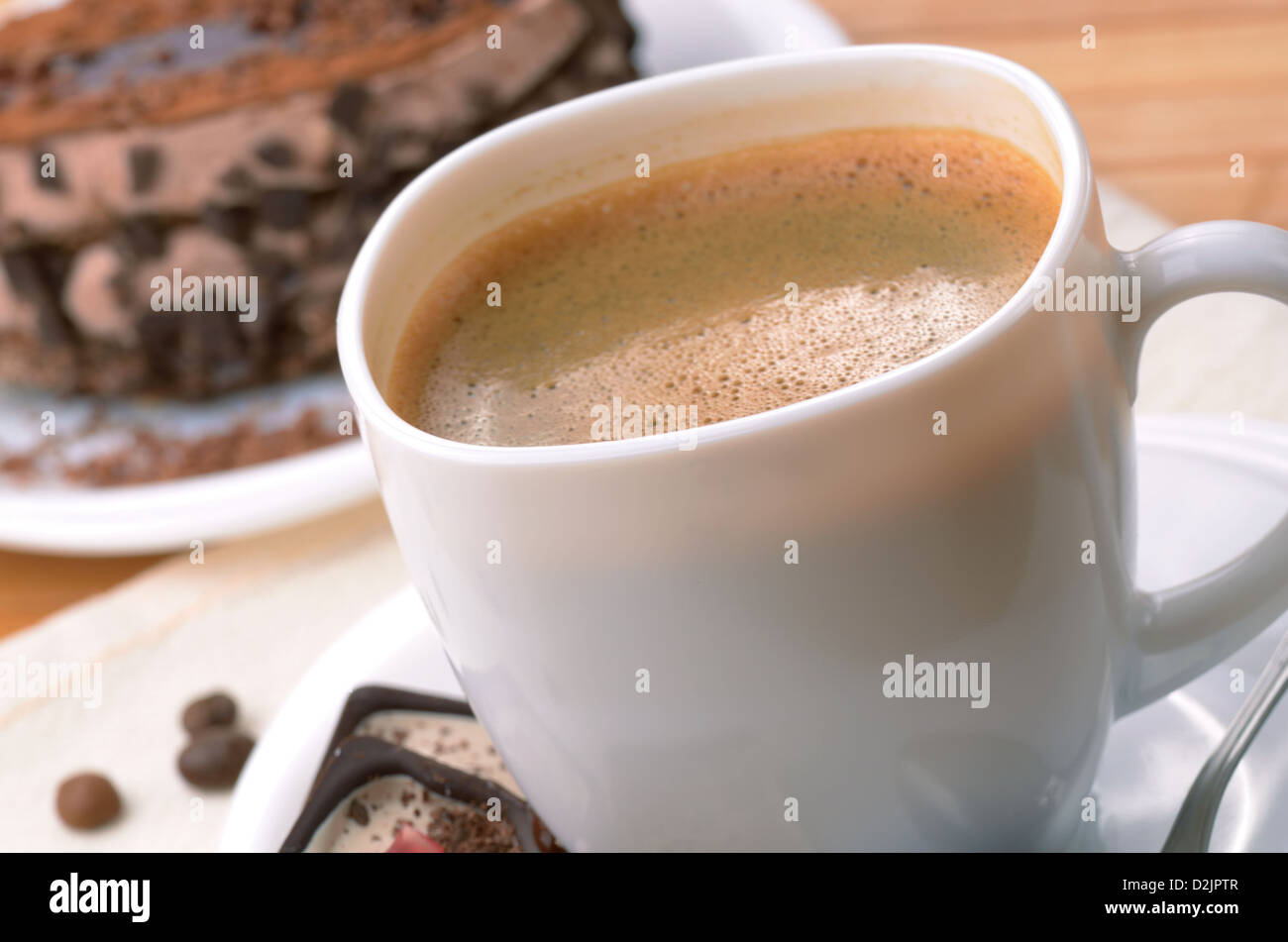 Coffee cup with chocolate dessert cake aside Stock Photo