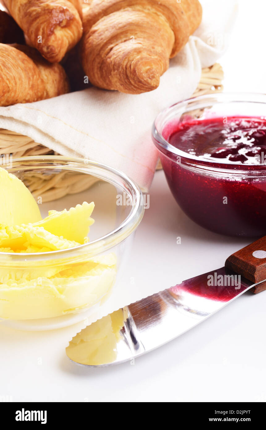 Croissants, jam and butter over white Stock Photo Alamy