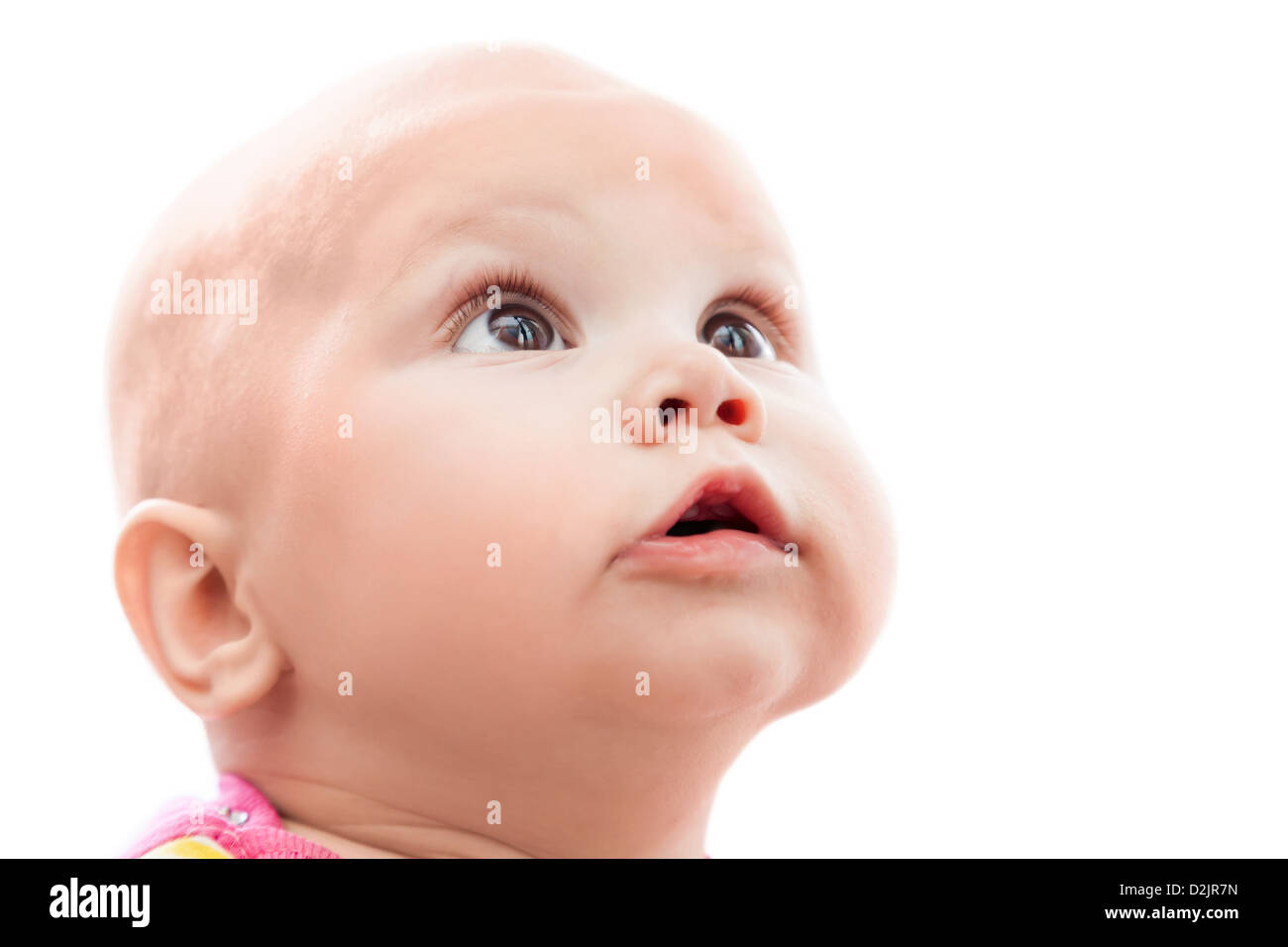 Isolated on white portrait of a little nice Caucasian baby surprise looking up Stock Photo