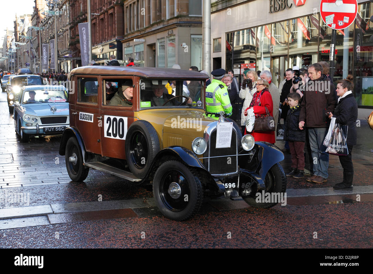 Buchanan Street, Glasgow, Scotland, UK, Saturday, 26th January, 2013. Participants depart in their cars before the start of the Monte Carlo Classic Rally with Tommy Bryce leading the way in his 1928 Citroen, Number 200 Stock Photo