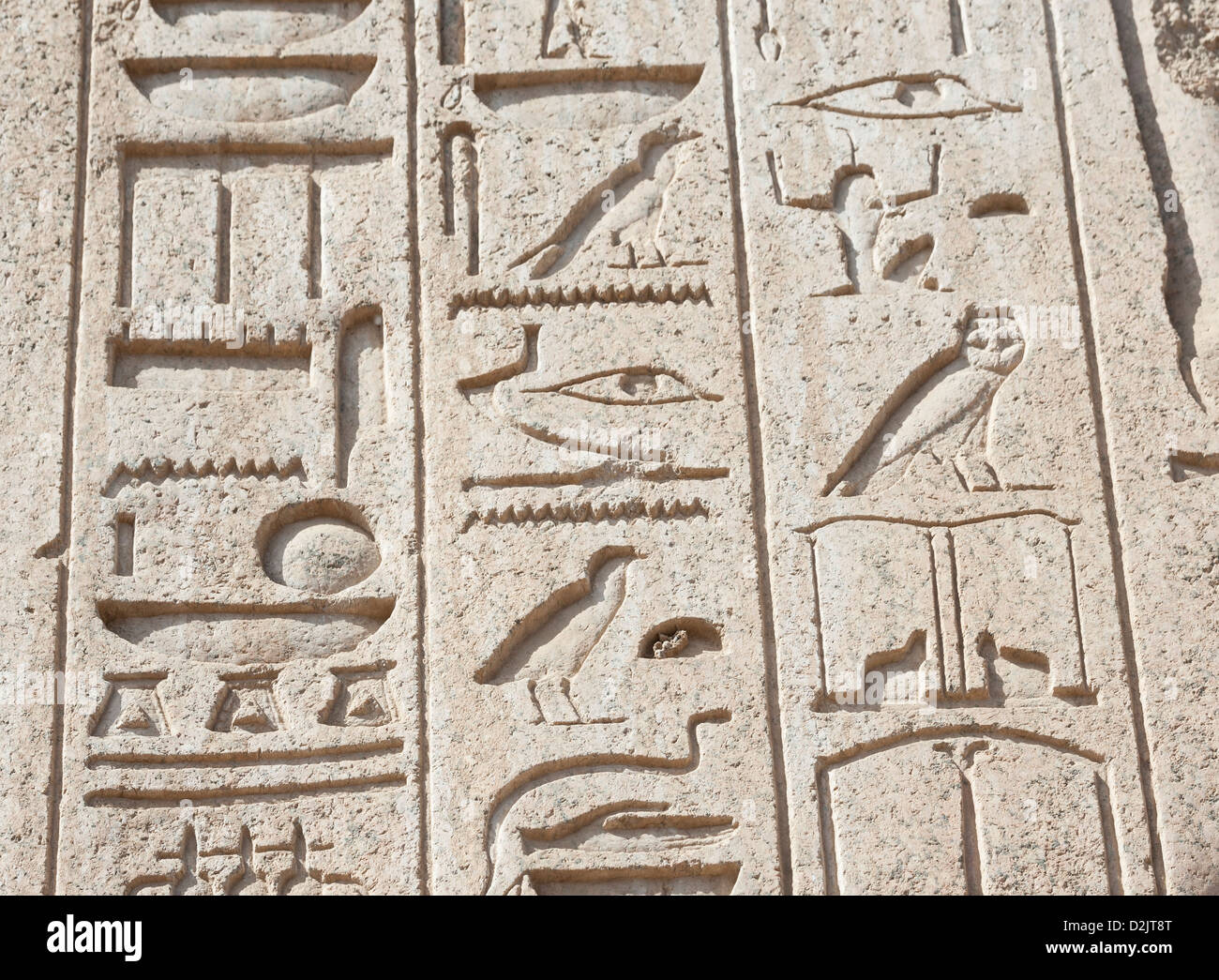 Ancient Egyptian hieroglyphic carvings on a temple wall at Karnak in