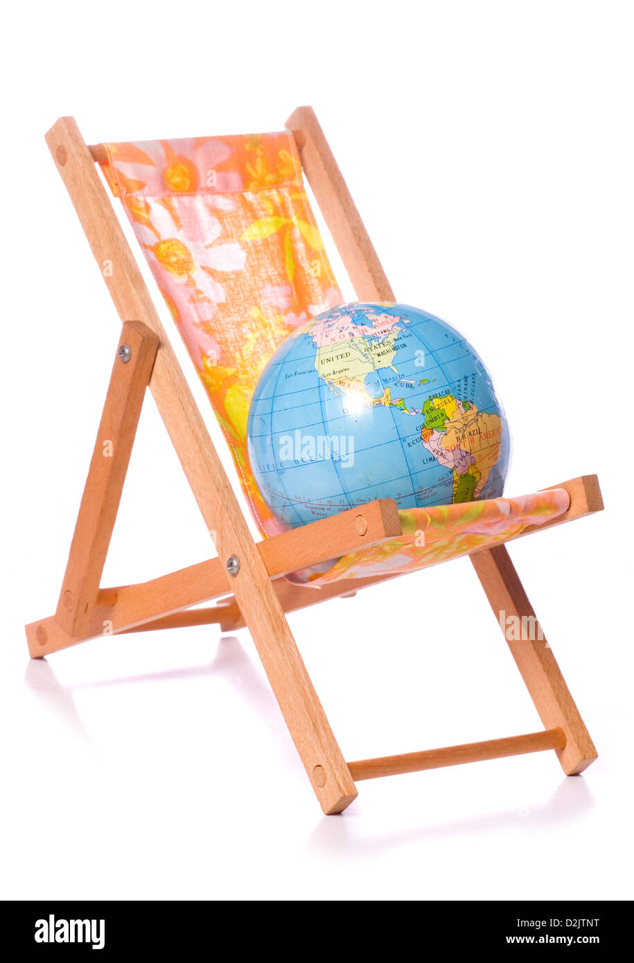 Deck chair and globe studio cutout Stock Photo