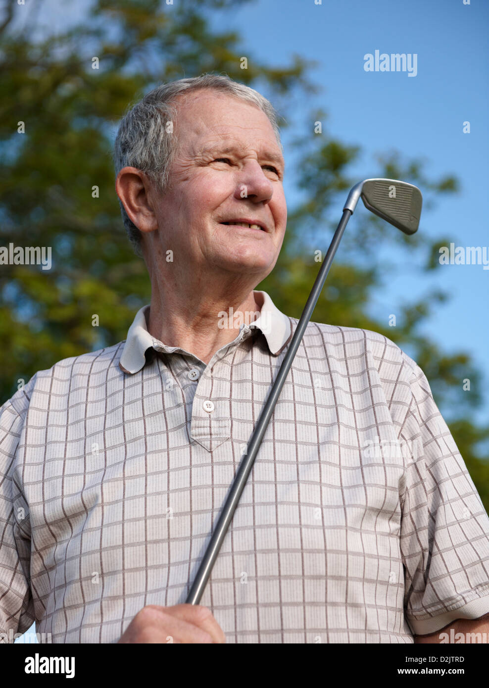 Golfer with golf club Stock Photo Alamy