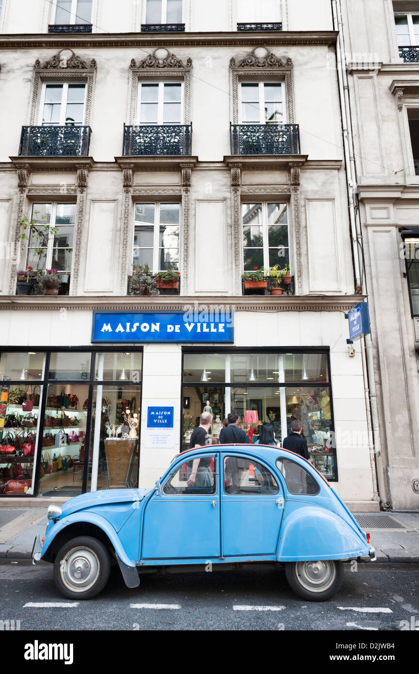 Cute blue Citroën 2CV car parked outside a shop in the Marais, Paris, France Stock Photo