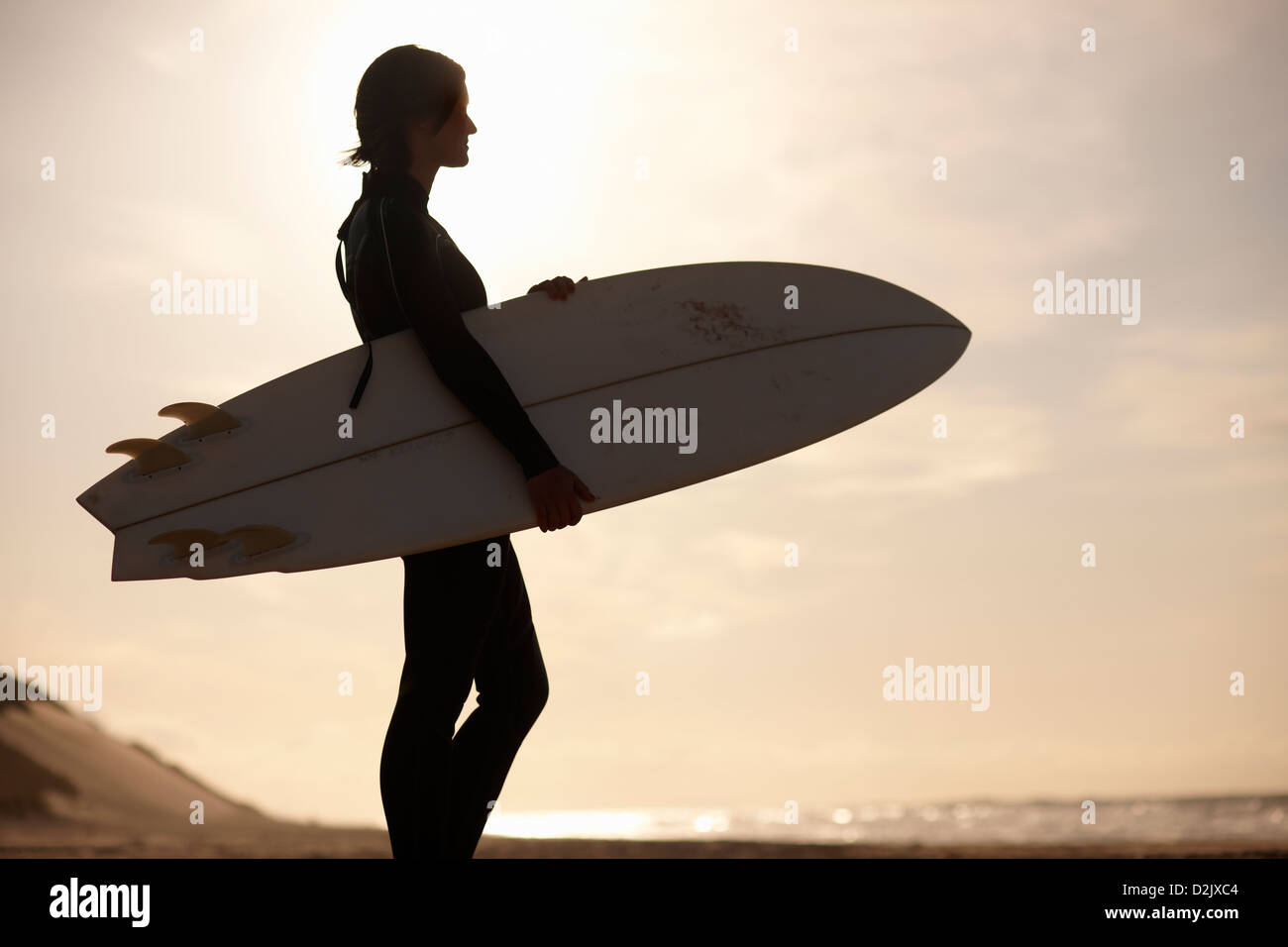 Female surfer in wetsuit on beach hi-res stock photography and images ...