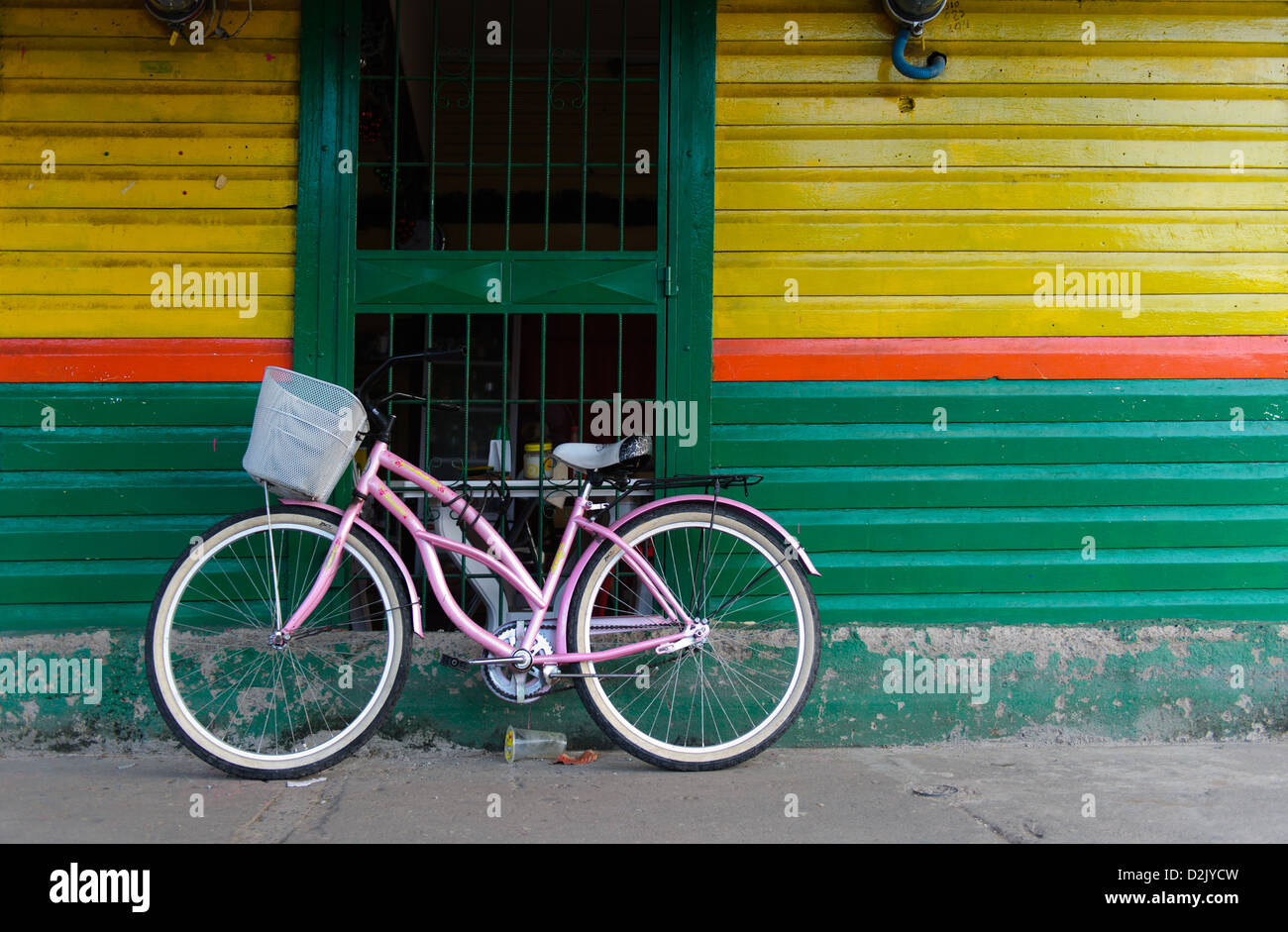 Bicycle in front of colourful wooden building in the center of  port city of Puntarenas,Costa Rica. Stock Photo