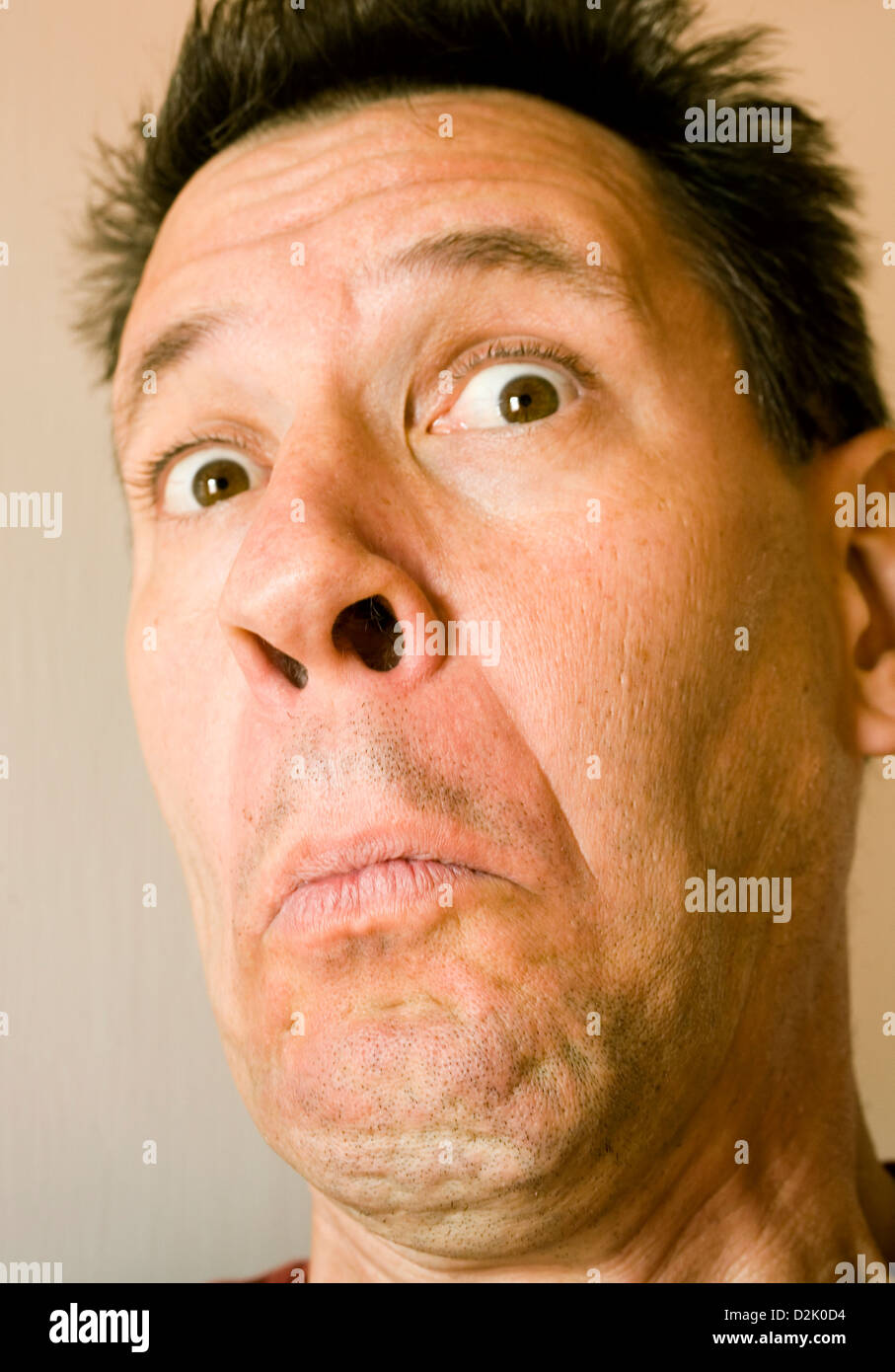 Photo of an attractive man with a very silly expression. Stock Photo