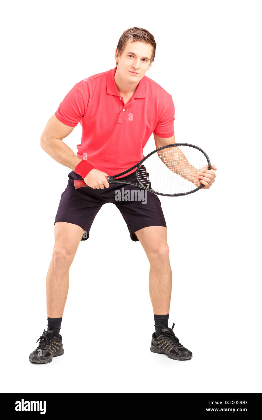 Full length portrait of a male tennis player holding a racket isolated ...