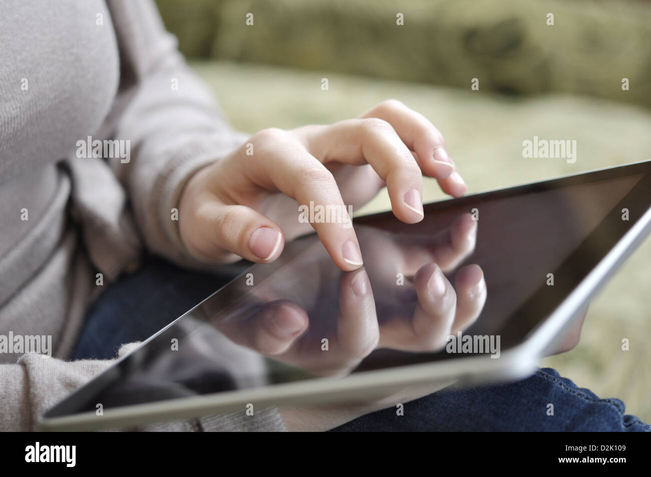 young woman using tablet pc at home Stock Photo - Alamy