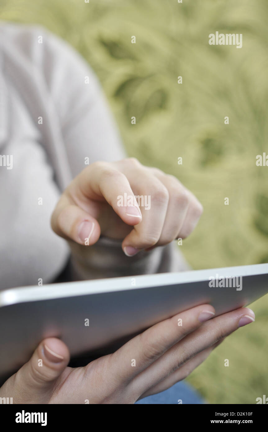 young woman using tablet pc at home Stock Photo - Alamy