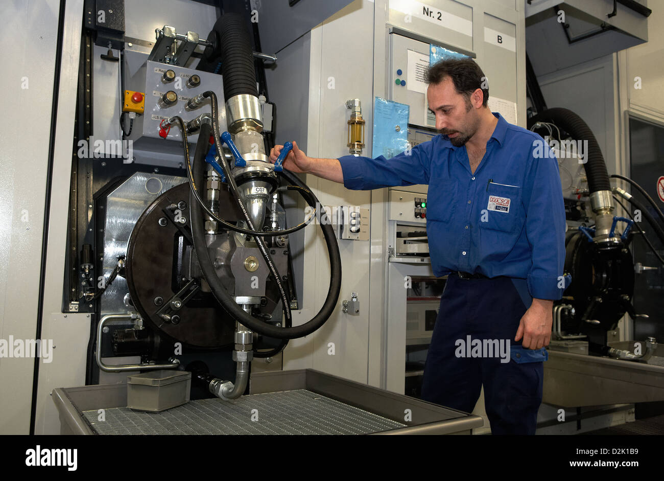 Berlin, Germany, employee controls a hydraulic pump on a test stand