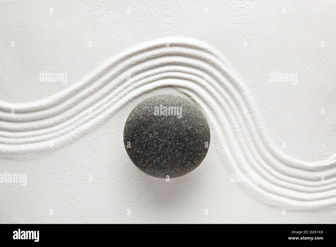 Zen stone in sand Stock Photo