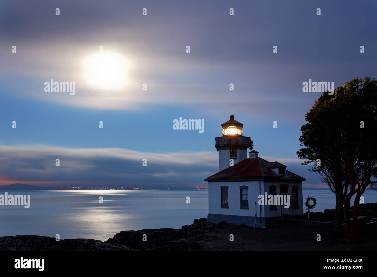 Lime Kiln Lighthouse stands watch over Haro Strait at dawn, Washington Stock Photo