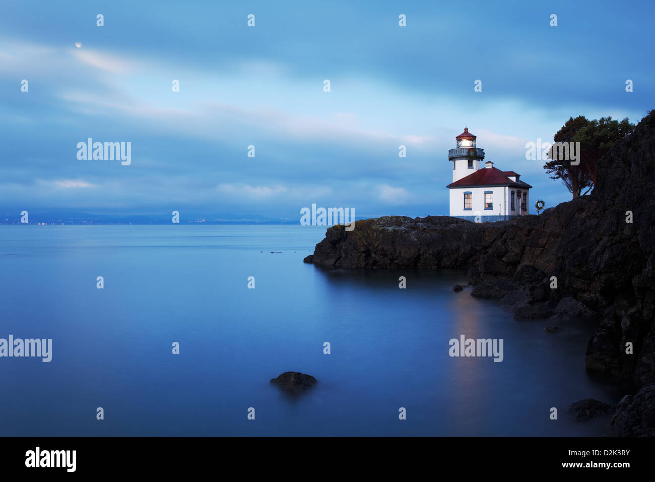 Lime Kiln Lighthouse stands watch over Haro Strait at dawn, Washington Stock Photo