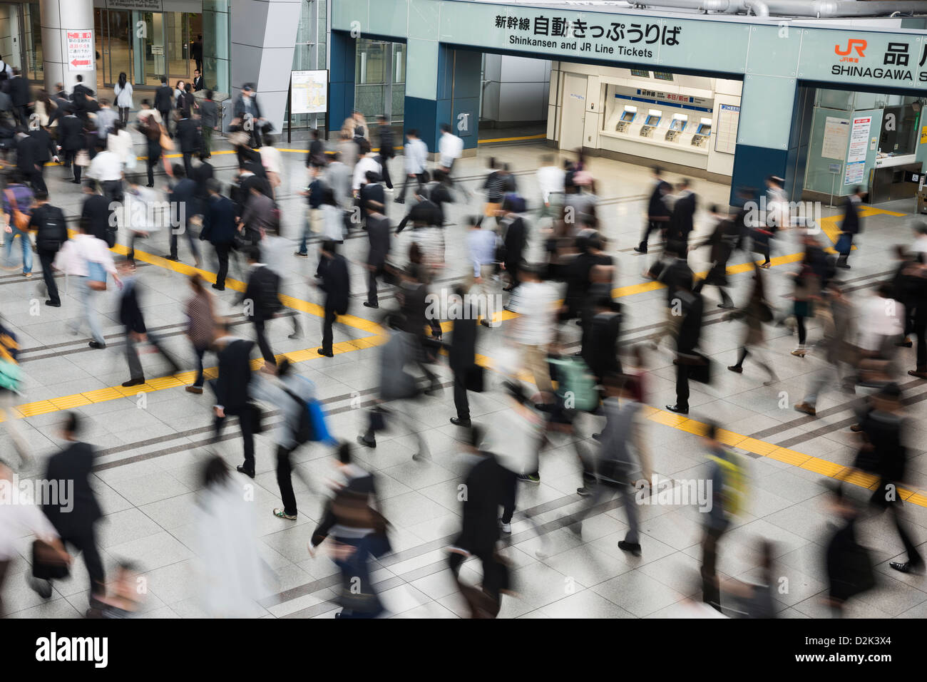 Workers commuting to work at the busy Shinagawa Station in Tokyo Japan Stock Photo