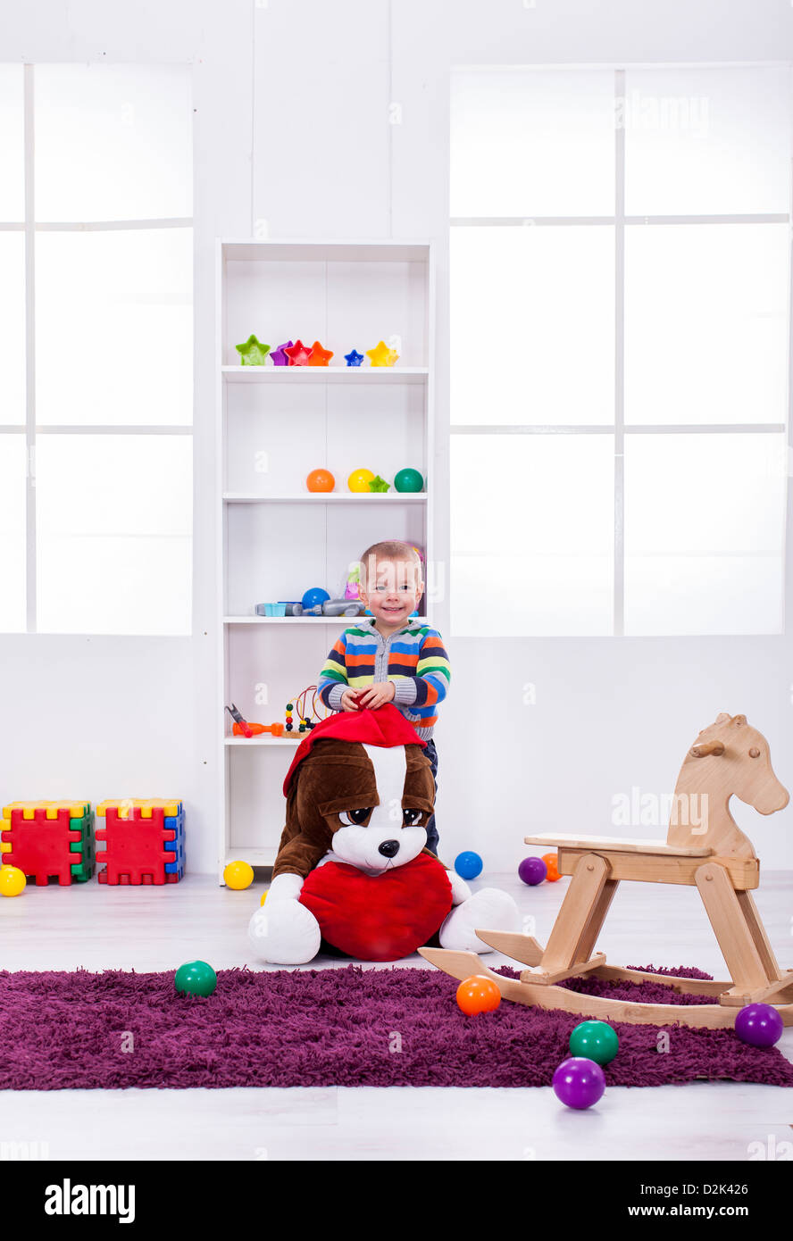 Baby boy with toys Stock Photo - Alamy