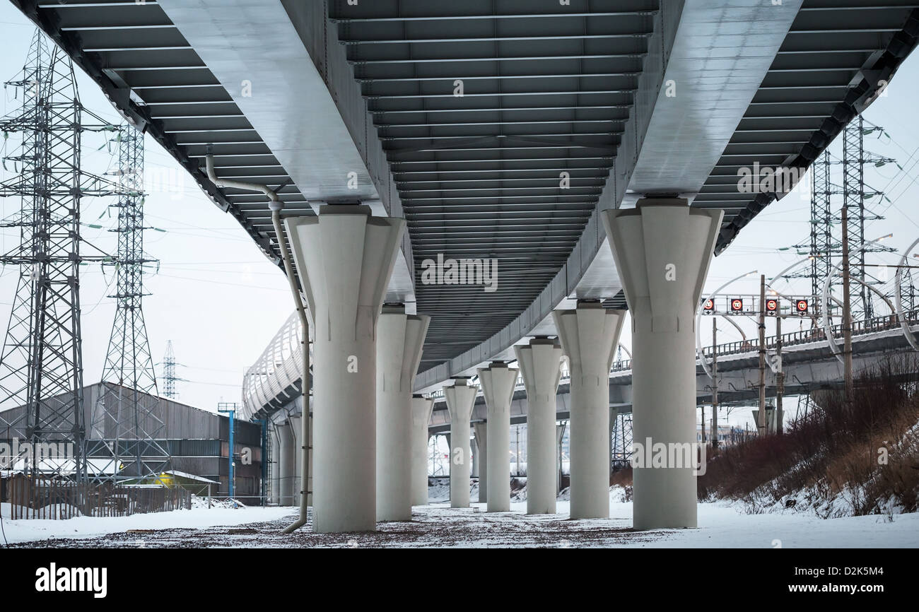 Urban scene with bottom view of steel automotive bridge Stock Photo