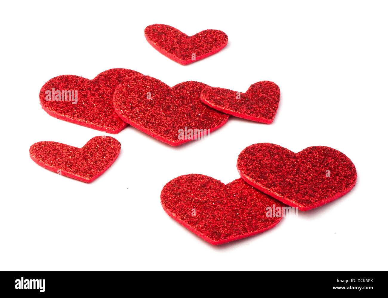 Red shiny hearts on white background. Brocade made hearts Stock Photo ...
