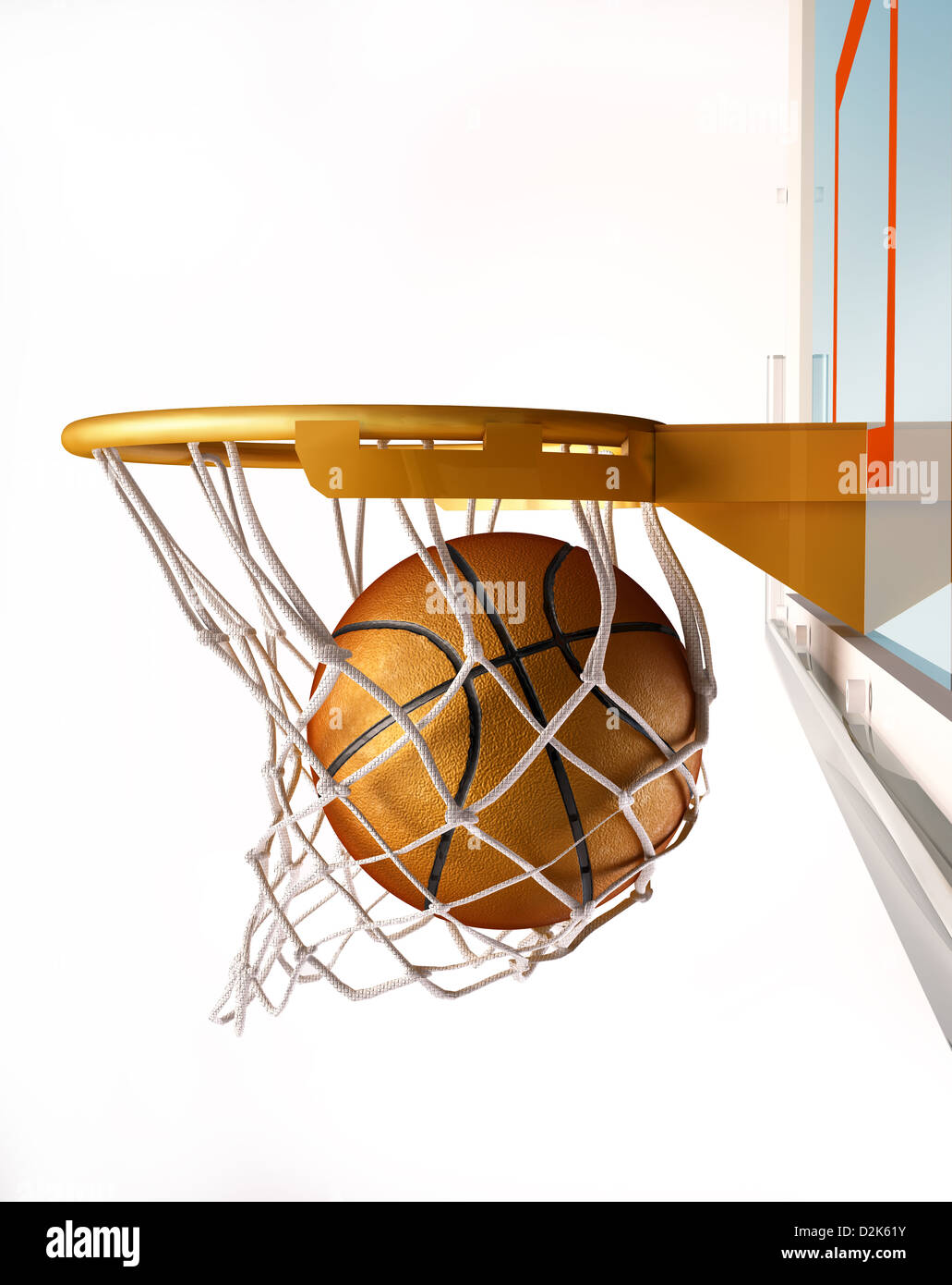 Basket ball centering the basket, with the ball inside the net, close