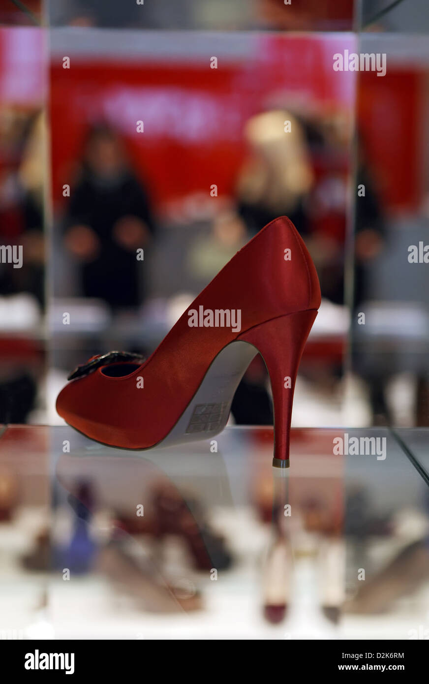 London, United Kingdom, red high heel shoe woman in a shop window Stock Photo