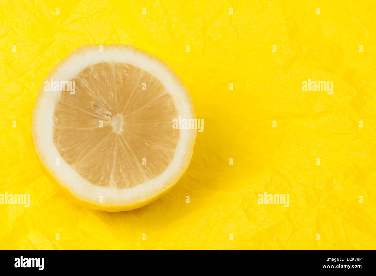 Lemon on a yellow background. Studio shot. Stock Photo