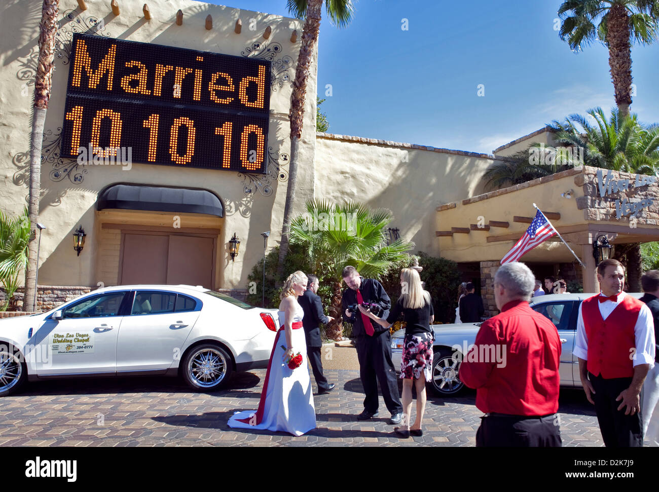 A RECENTLY MARRIED COUPLE OUTSIDE VIVA LAS VEGAS WEDDING CHAPEL IN DOWNTOWN LAS VEGAS , OCTOBER 2010 Stock Photo