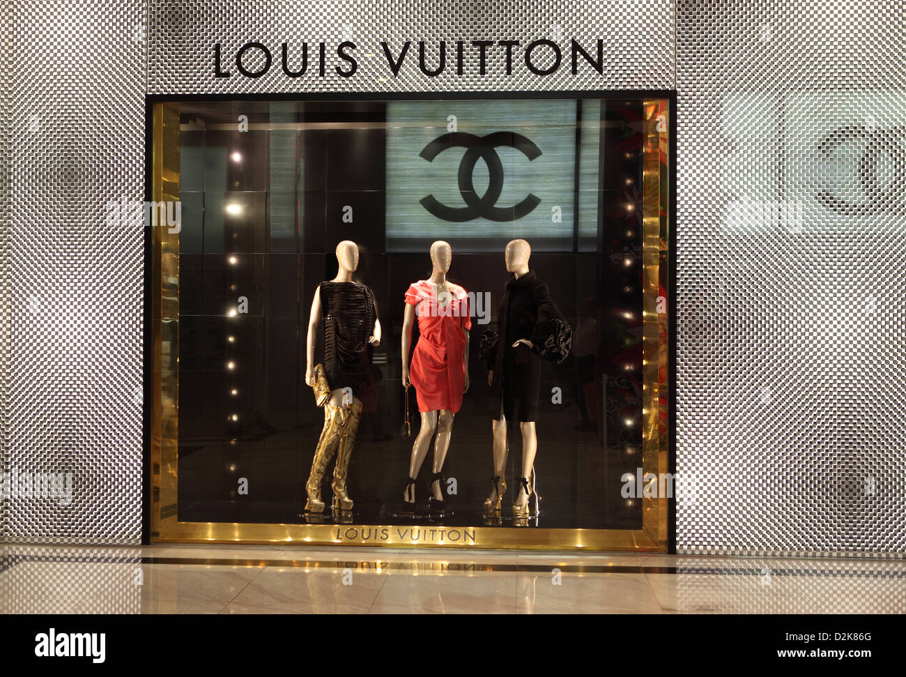 Hong Kong, China, from Coco Chanel logo reflected in a window of Louis Vuitton Stock Photo