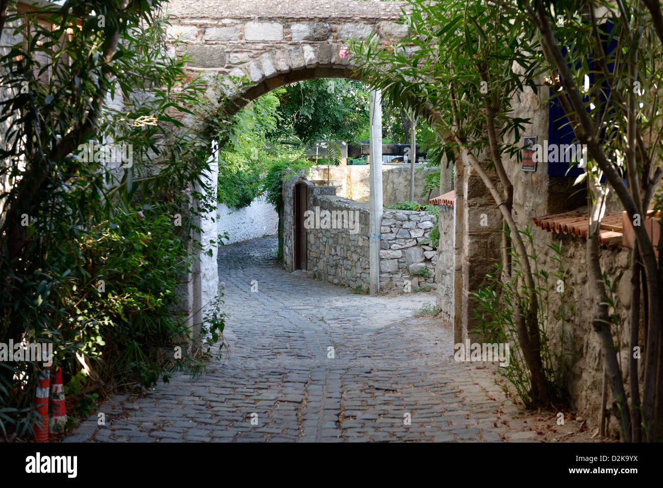 Bodrum Turkey. Quiet peaceful leafy cobbled narrow alleyway behind the waterfront promenade. Stock Photo