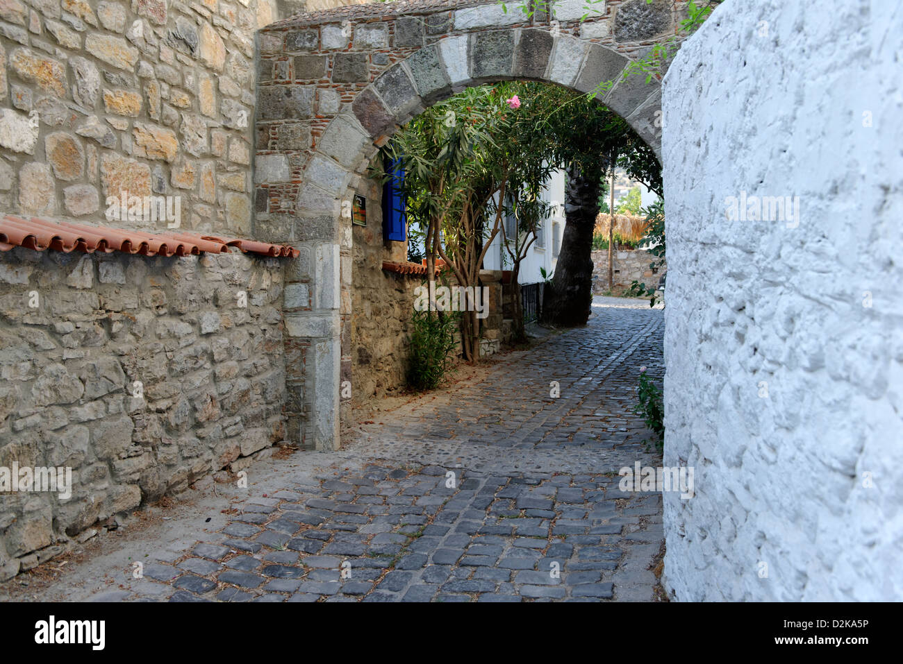Bodrum Turkey. Quiet peaceful leafy cobbled narrow alleyway behind the waterfront promenade. Stock Photo