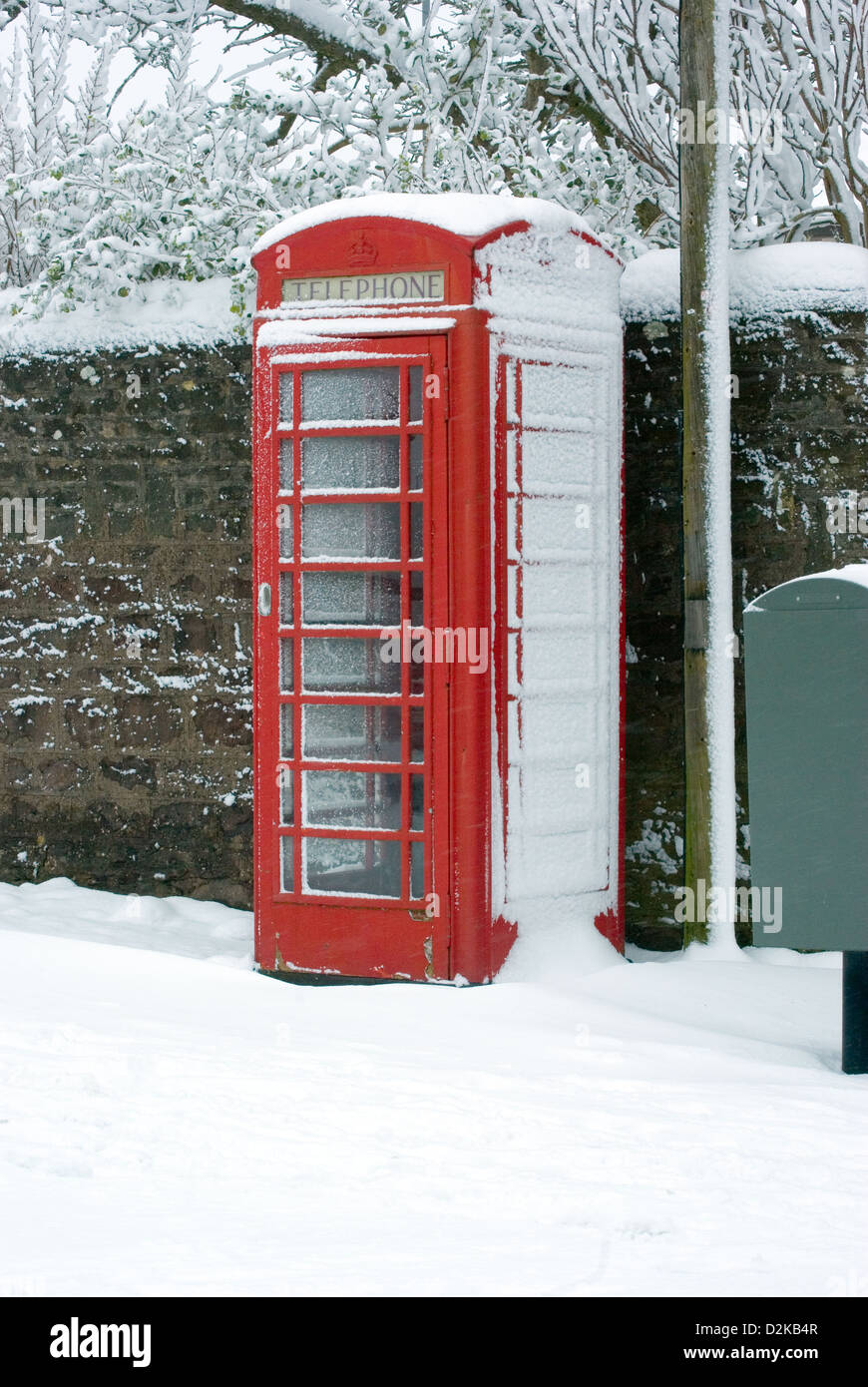 Uk , British, Red Telephone box with snow. Stock Photo
