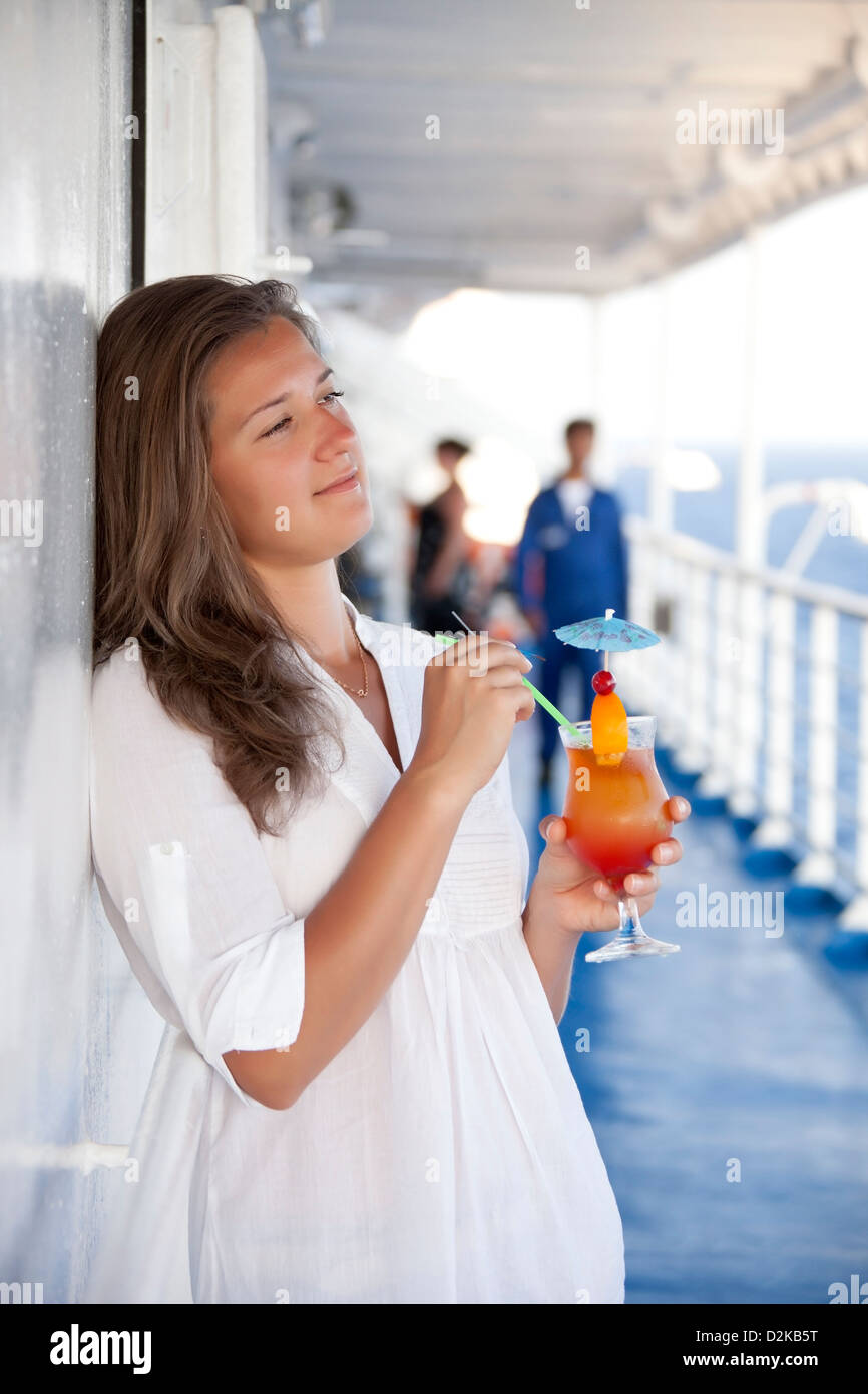 Girl with a cocktail on the deck of dreams day Stock Photo